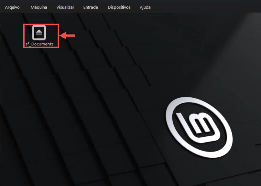 Área de trabalho do Linux Mint com o ícone sf_Documents e a seta indicando a pasta compartilhada