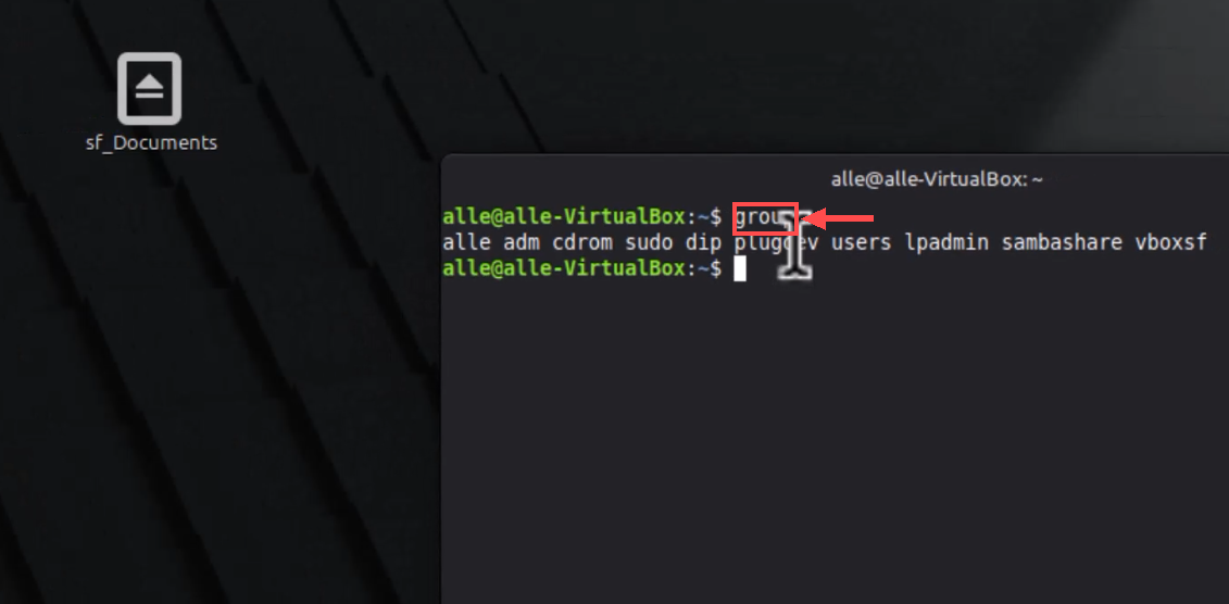 Terminal após reiniciar com a seta indicando o comando groups e vboxsf na lista de grupos da conta